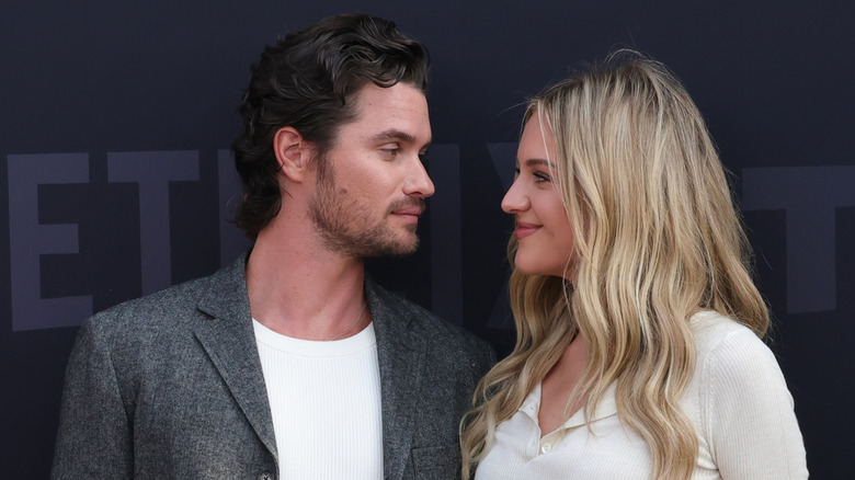 Chase Stokes and Kelsea Ballerini looking into each other's eyes