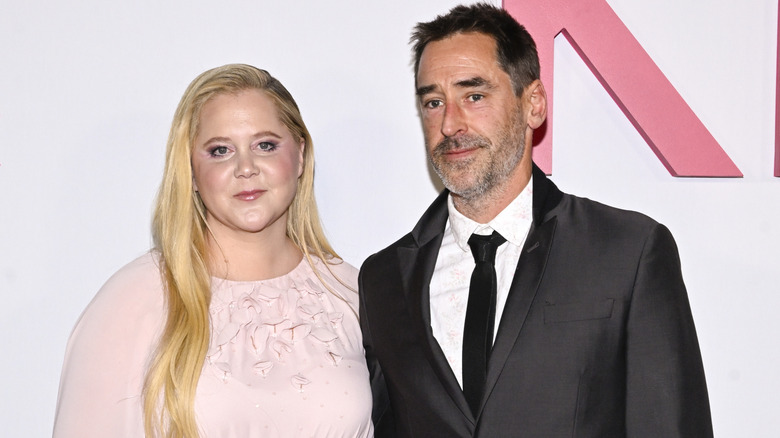 Amy Schumer and Chris Fischer posing