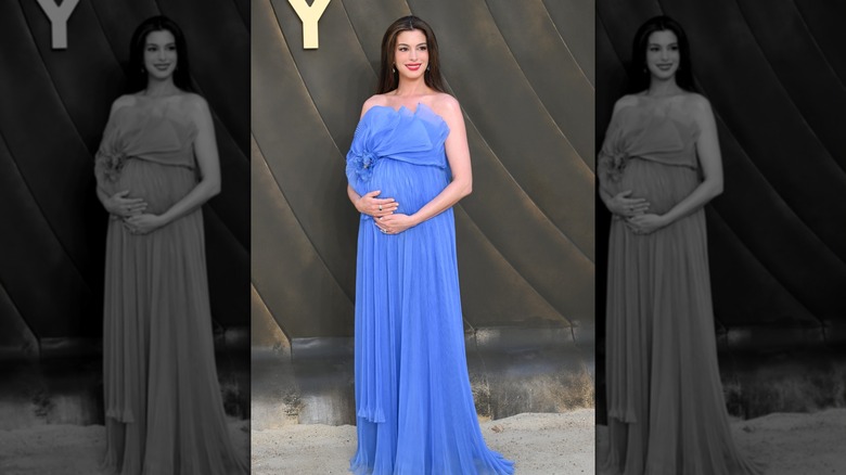 Anne Hathaway in a blue pregnancy gown at 'The Odyssey' premiere
