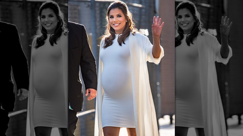 Eva Longoria in a white bodycon dress and shrug during pregnancy
