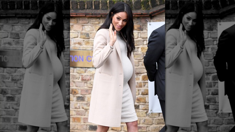 Meghan Markle in a beige pregnancy dress and coat