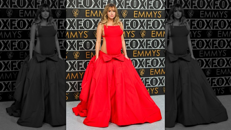 Suki Waterhouse in a red cutout ballgown while pregnant