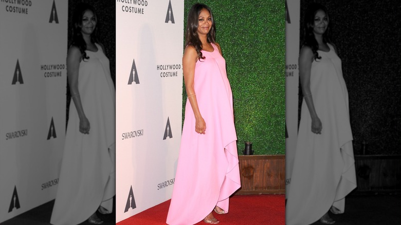 Zoe Saldana wearing an asymmetrical pink gown during pregnancy