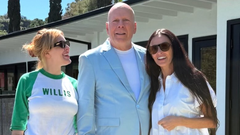 Rumer Willis, Bruce Willis, and Demi Moore smiling in back yard in 2025