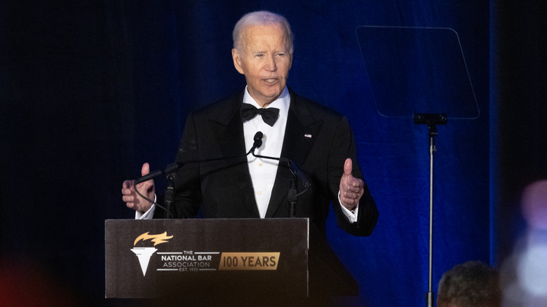 Joe Biden in black tie giving a speech