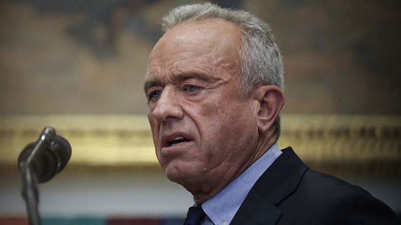 Closeup side profile of RFK Jr. speaking into mic