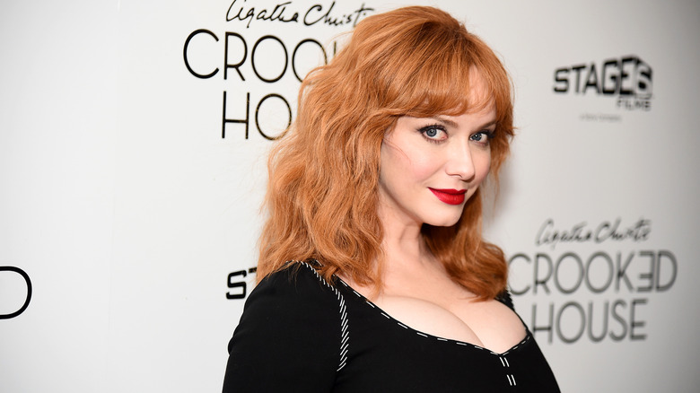 Christina Hendricks poses at an event