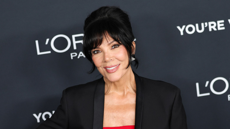 Kris Jenner smiling while looking at the camera