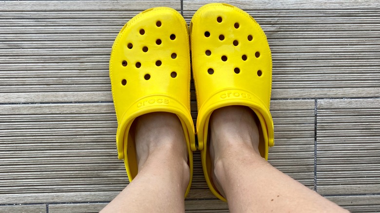 Woman wearing yellow Crocs
