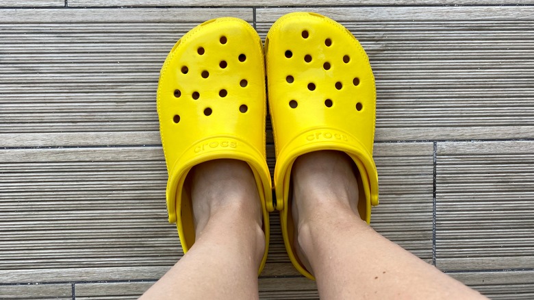 A pair of bright yellow Crocs