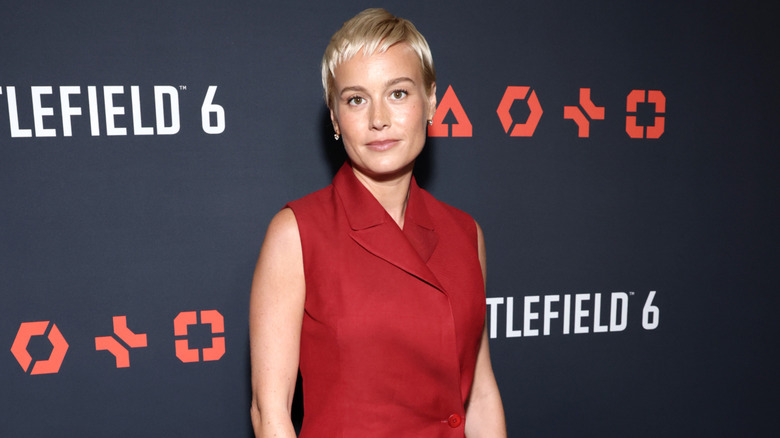 Bree Larson posing in front of a grey background at the "Battlefield 6" premiere