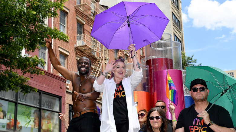 Kelly Osbourne holding a purple umbrella in the 2017 New York Pride Parade