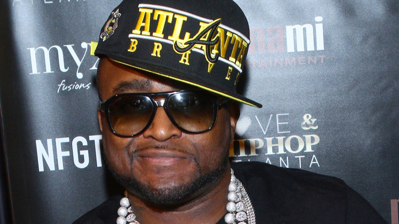 Shawty Lo posing on step-and-repeat