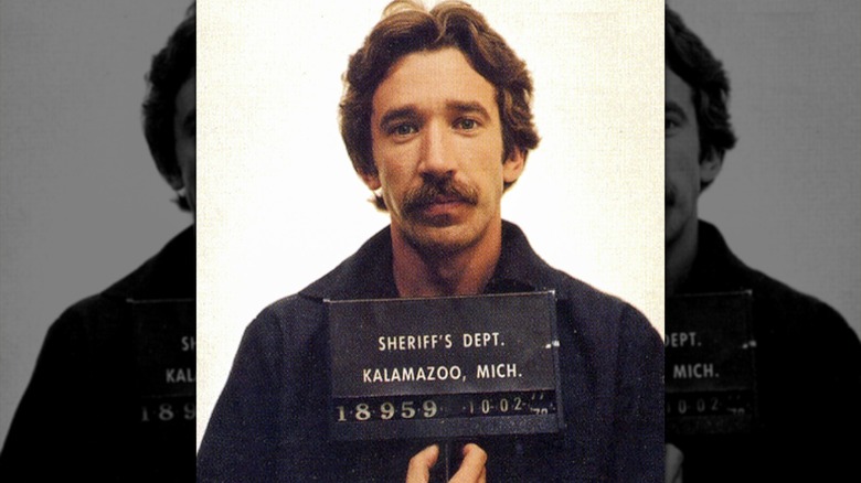 Tim Allen with a mustache in his mugshot