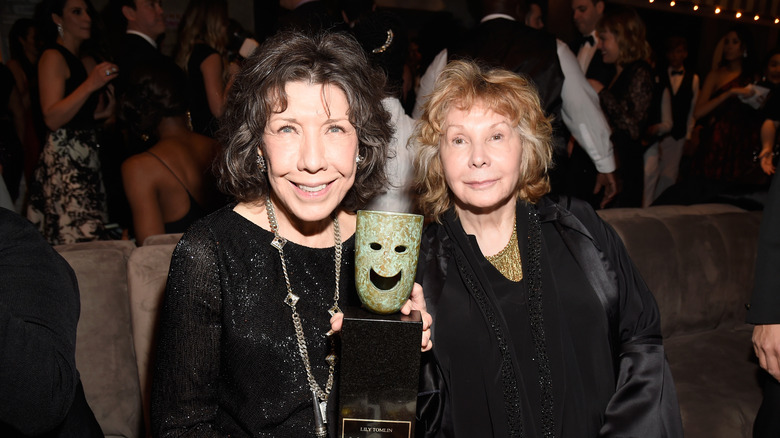 Lily Tomlin with her Lifetime Achievement Award beside Jane Wagner