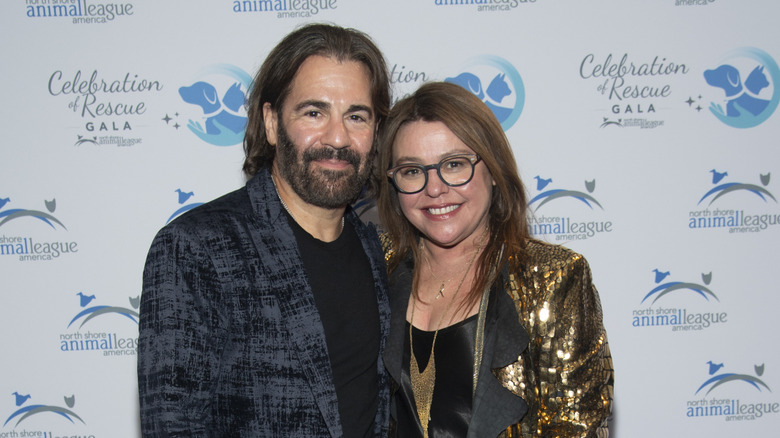Rachael Ray in a sequinned golden blazer beside John Cusimano