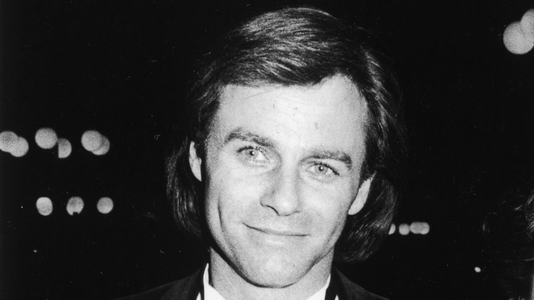 Black and white photo of Tristan Rogers smiling in 1985