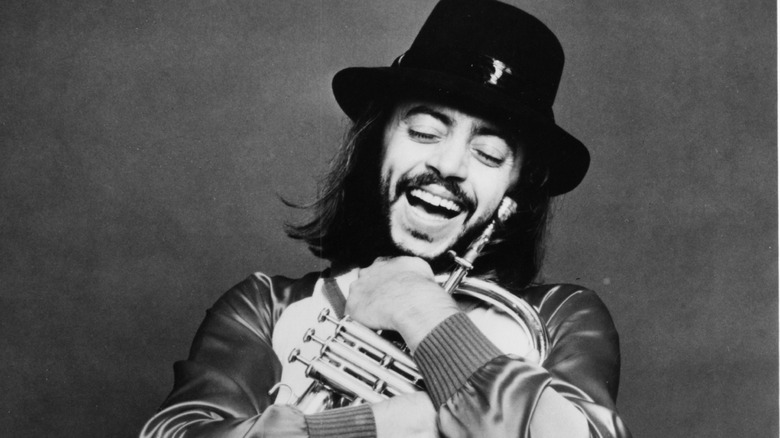 Chuck Mangione posing with his flugelhorn