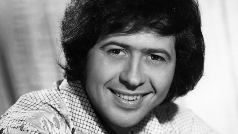 Black and white photo of Wayne Osmond smiling