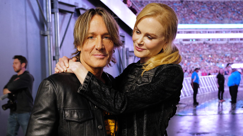 Nicole Kidman with her arms around Keith Urban