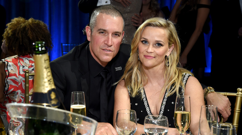 Reese Witherspoon and Jim Toth at an awards show table