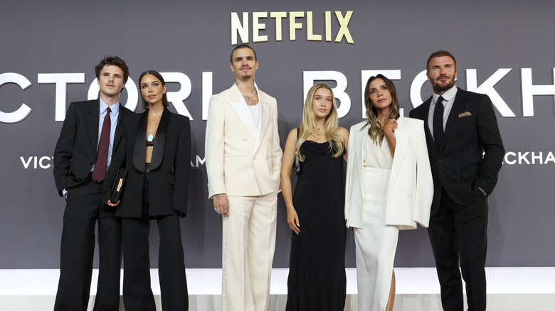 The Beckham family wearing black and white