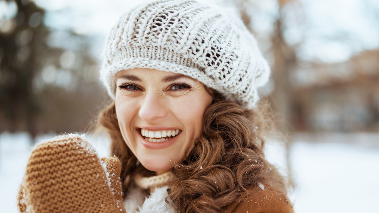 A woman wearing a hat in winter