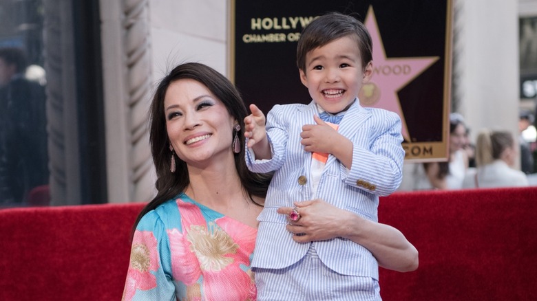 Lucy Liu with her son on the Hollywood Walk of Fame