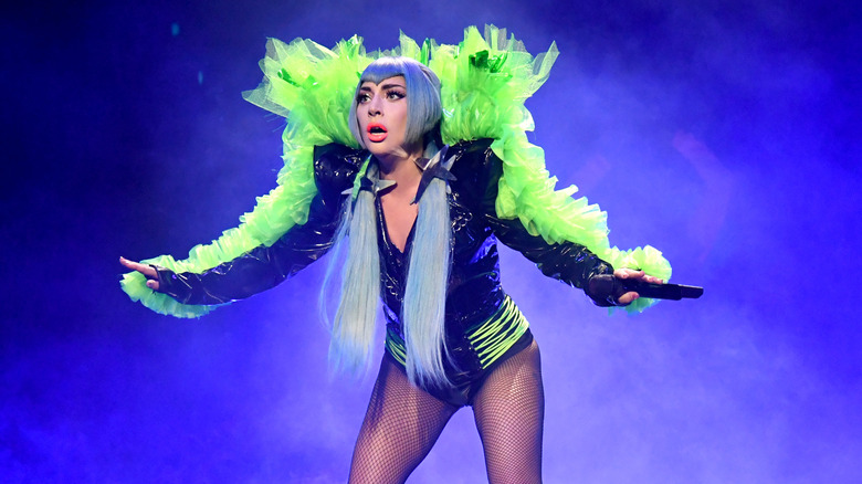 Lady Gaga on stage in elaborate green costume during "Super Saturday Night" performance in 2020