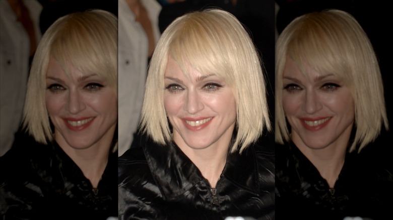 Closeup of Madonna smiling in short blond wig in Japan in 2006