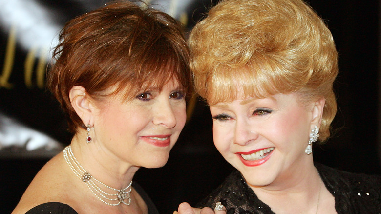 Carrie Fisher smiling with mom Debbie Reynolds