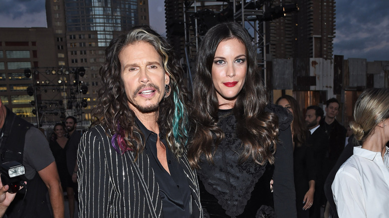 Liv Tyler posing with Steven Tyler