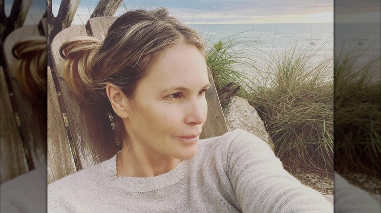 Elle Macpherson taking a selfie on the beach