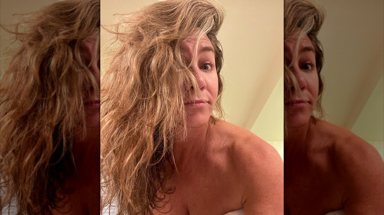 Jennifer Aniston with messy hair and no makeup
