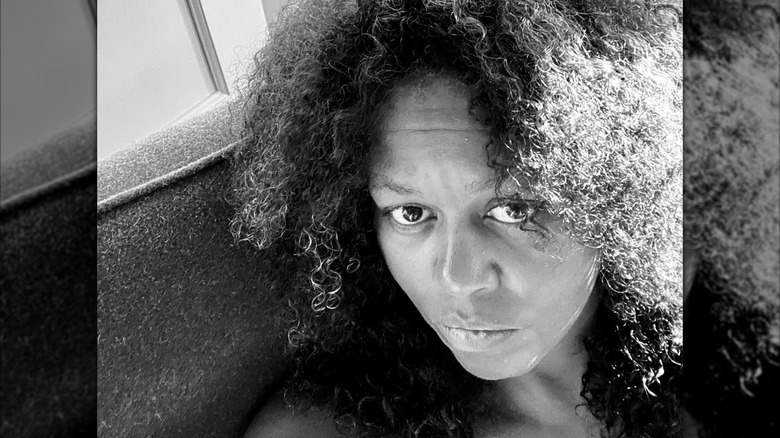 Michelle Obama taking a makeup-free black and white selfie