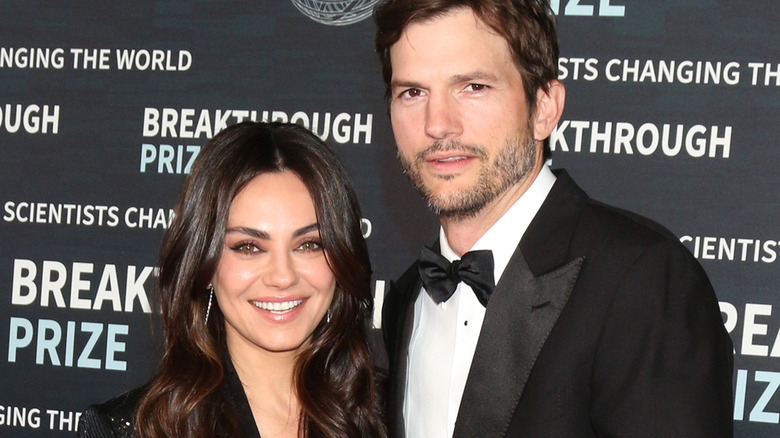 Mila Kunis and Ashton Kutcher pose for photos at the 9th Breakthrough Prize Ceremony Arrivals at the Academy Museum of Motion Pictures in Los Angeles (2023)