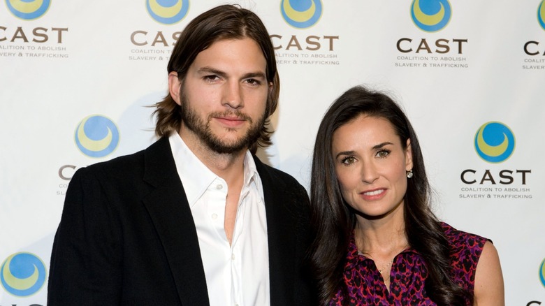 Ashton Kutcher and Demi Moore posing for a photo in 2011