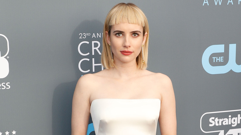 Emma Roberts posing with a blond fringe at the Critics' Choice Awards