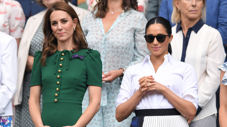 Kate Middleton and Meghan Markle watching a game