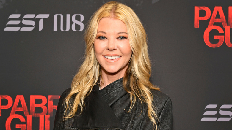 Tara Reid posing on step-and-repeat