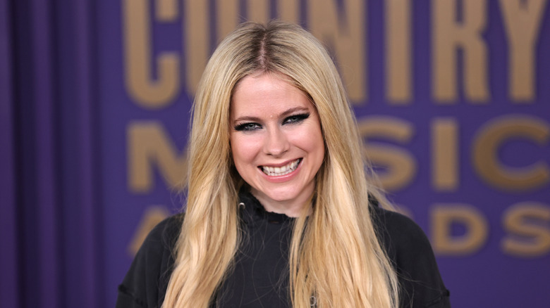 Avril Lavigne wearing her signature dark eye makeup at the Country Music Awards