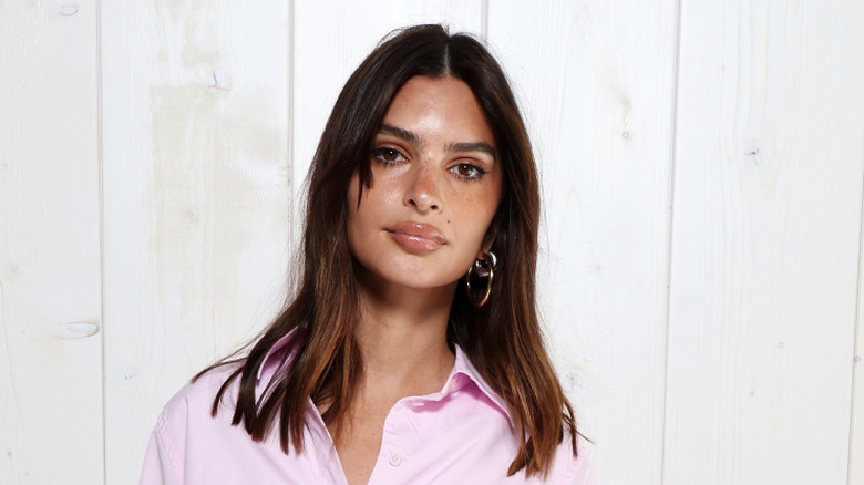 Emily Ratajkowski in an oversized baby pink shirt