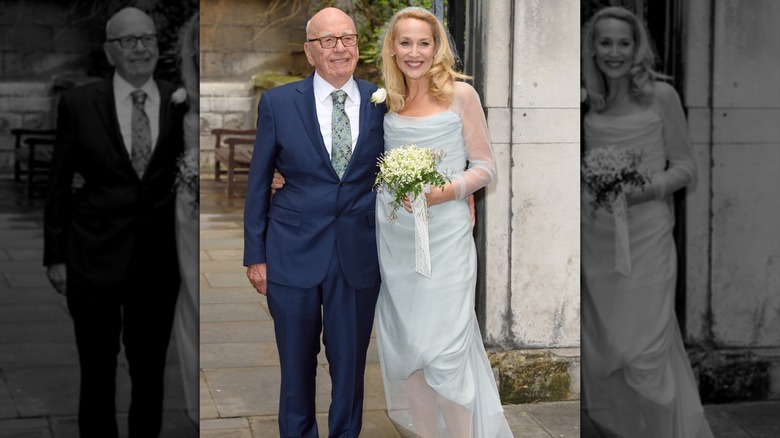 Jerry Hall in her baby blue wedding dress beside Rupert Murdoch