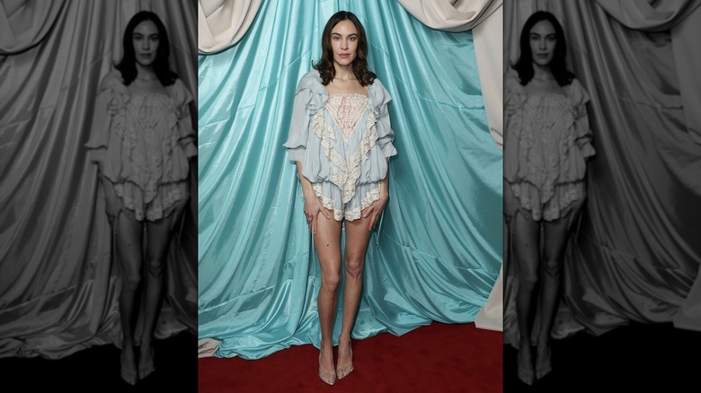 Alexa Chung posing on the red carpet in 2025