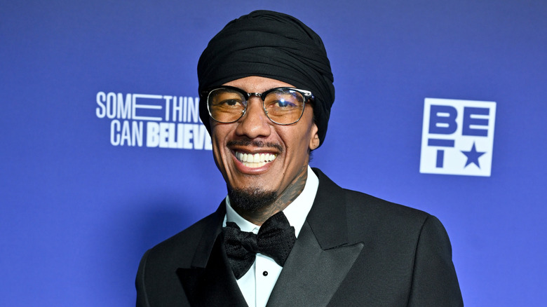 Nick Cannon in a turban on the red carpet in February 2026