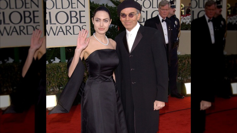 Billy Bob Thornton and Angelina Jolie smiling on the red carpet