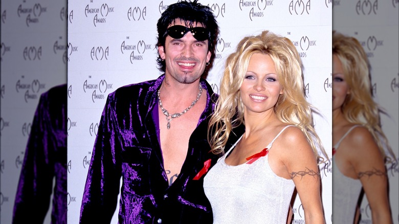 Pamela Anderson and Tommy Lee smiling at an award show.