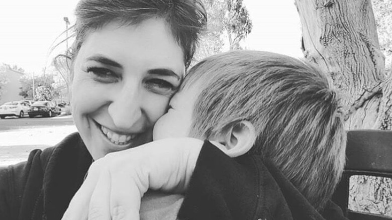 Mayim Bialik hugging her kid