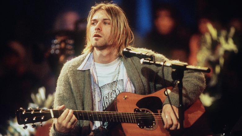 Kurt Cobain playing an acoustic guitar