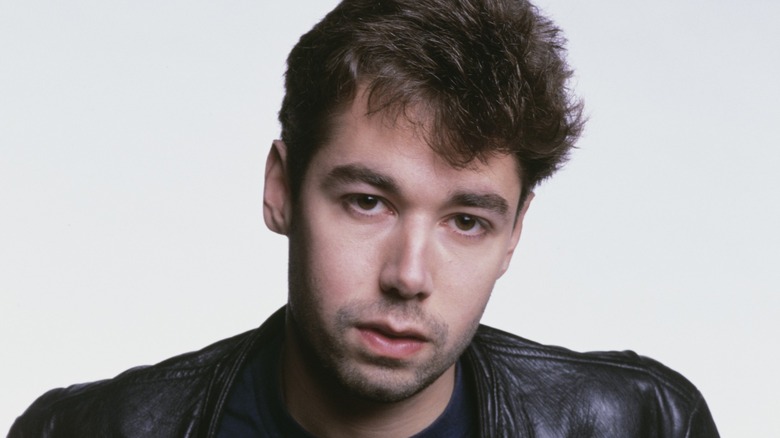 Adam Yauch in a leather jacket on a white background